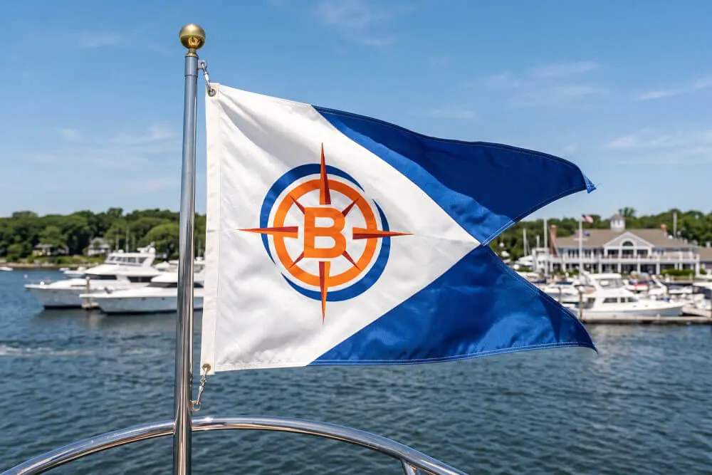 Custom burgee flag displayed on a boat at a marina