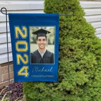 Rip-resistant custom garden flag displayed in a yard, durable polyester designed for outdoor graduation celebration