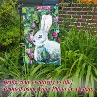 Custom garden flag printed with original bunny artwork surrounded by pink flowers, displayed in a lush green garden with the caption 'Printed from Your Photo or Design.