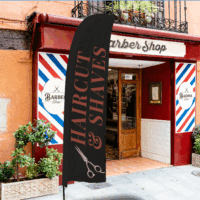 Custom feather flags displayed outside a barber shop