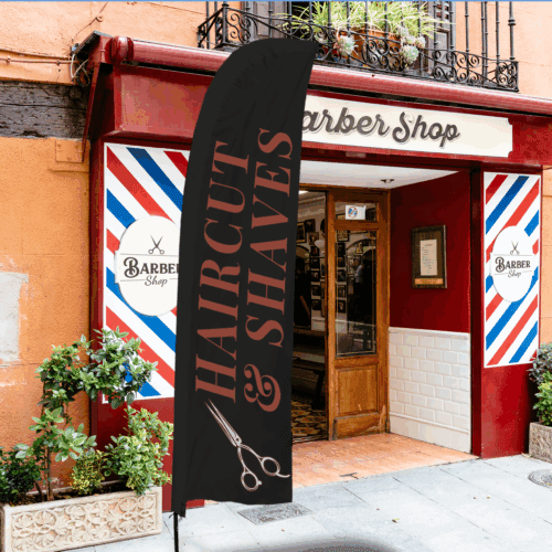 Custom feather flags displayed outside a barber shop