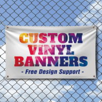 Custom vinyl banner with free design support displayed on chain link fence