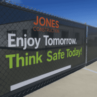 Custom safety mesh banner with bold text for workplace awareness